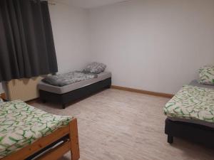 Postel nebo postele na pokoji v ubytování gemütliche Wohnung im Herzen von Heilbronn