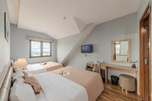 Postel nebo postele na pokoji v ubytování Gia Nguyễn Hotel Dalat