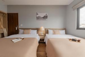 Voodi või voodid majutusasutuse Gia Nguyễn Hotel Dalat toas