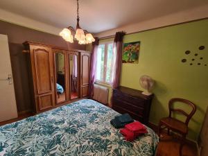 Posteľ alebo postele v izbe v ubytovaní La petite maison de Paule