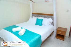 Postel nebo postele na pokoji v ubytování Calumet Suites airbnb and accommodation