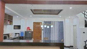 a kitchen with a counter top in a room at Balai Julian in Tacloban