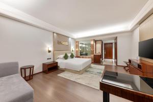 TV in/ali zabaviščno središče v nastanitvi Wyndham Garden Foshan Nanhai