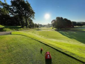 a view of a golf course with a green at Stationsterrassen 15 in Båstad
