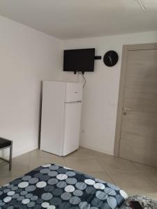 A television and/or entertainment centre at Terme Apartment Levico