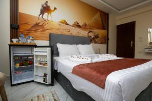 Postelja oz. postelje v sobi nastanitve Pyramids Palace INN