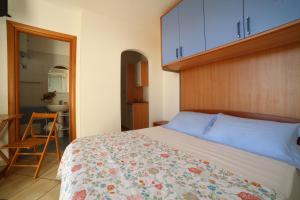Postel nebo postele na pokoji v ubytování Case vacanza Torre Mozza Ugento Afr0dite