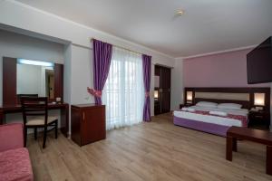 Postel nebo postele na pokoji v ubytování White Lilyum Hotel - All Inclusive