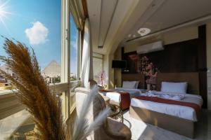 Postelja oz. postelje v sobi nastanitve Pyramids Palace INN