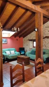 a living room with couches and a table at La Canaleja in Cigüenza