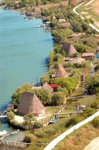 an aerial view of a village next to the water at Ferrari Apartments Panorama Sea View in Caorle