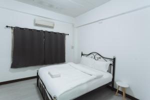 Giường trong phòng chung tại GO INN Maya - Nimman Chiang Mai