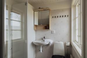 Koupelna v ubytování Trakt Forest Hotell Hotellstugor + 25 fotografií