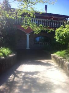 a house with a walkway in front of a building at La casa di Mario in Rocca di Papa