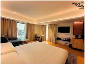 Postel nebo postele na pokoji v ubytování Pride Plaza Hotel, Ahmedabad + 37 fotografií