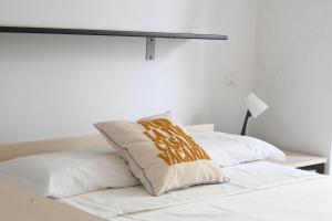 Postel nebo postele na pokoji v ubytování N044 - Numana, nuovo trilocale con aria condizionata e parcheggio