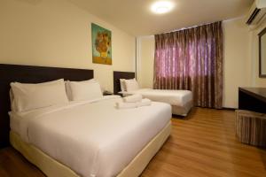 Ένα ή περισσότερα κρεβάτια σε δωμάτιο στο De Swift Hotel
