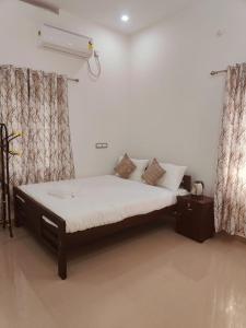 Postel nebo postele na pokoji v ubytování Palm Paradise Home Stay