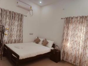 Postel nebo postele na pokoji v ubytování Palm Paradise Home Stay