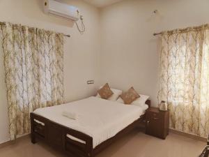 Postel nebo postele na pokoji v ubytování Palm Paradise Home Stay
