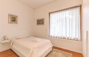 A bed or beds in a room at Gorgeous Home In Borgo San Dalmazzo Cn