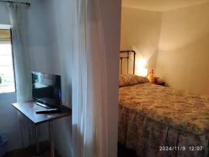 Ένα ή περισσότερα κρεβάτια σε δωμάτιο στο La Casita de San Nicolás +3 φωτογραφίες