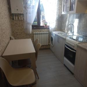 Kuchyň nebo kuchyňský kout v ubytování Violet guest house