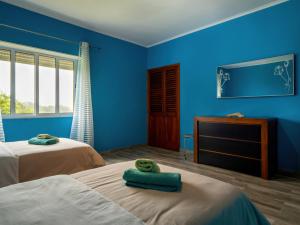 Ένα ή περισσότερα κρεβάτια σε δωμάτιο στο Casa dos cinco sentidos