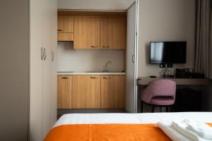 Postel nebo postele na pokoji v ubytování Hotel Royal