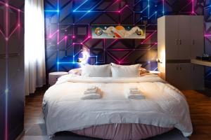 Postel nebo postele na pokoji v ubytování Hotel Royal