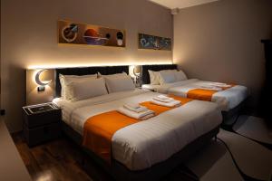 Postel nebo postele na pokoji v ubytování Hotel Royal