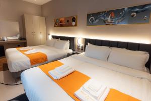 Postel nebo postele na pokoji v ubytování Hotel Royal