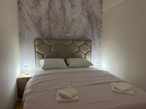 Postel nebo postele na pokoji v ubytování Apartman Happy Moments Kraljevo
