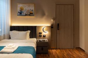 Postel nebo postele na pokoji v ubytování Hotel Royal