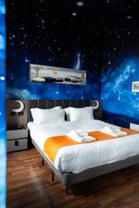 Postel nebo postele na pokoji v ubytování Hotel Royal
