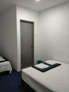 Postel nebo postele na pokoji v ubytování Enviropath Hotel