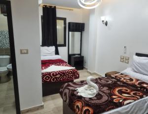 Ένα ή περισσότερα κρεβάτια σε δωμάτιο στο Summer Land Hotel