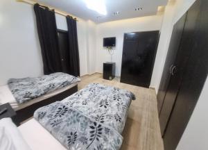 Ένα ή περισσότερα κρεβάτια σε δωμάτιο στο Summer Land Hotel