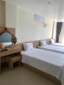 Postel nebo postele na pokoji v ubytování Anh Như Hostel Cat Ba