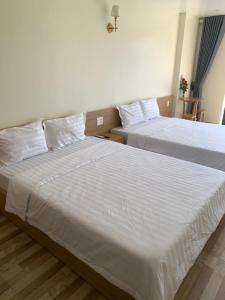 Postel nebo postele na pokoji v ubytování Anh Như Hostel Cat Ba