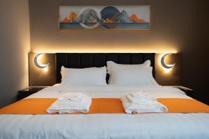 Postel nebo postele na pokoji v ubytování Hotel Royal