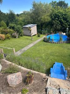 a backyard with a swimming pool and a garden at Haus Königsee "Seeblick" in Bad Oldesloe