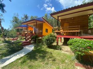 a house with a pathway leading to it at Baan Panseng Bungalow in Ko Kood