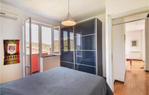 A bed or beds in a room at Stunning Home In Celle Ligure Sv,