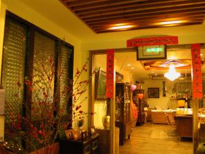 a store withinese signs on the walls of a room at Cingjing Dream town in Ren'ai