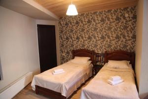 Letto o letti in una camera di Guesthouse David Zhorzholiani