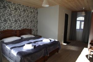 Letto o letti in una camera di Guesthouse David Zhorzholiani