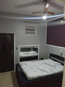 En eller flere senge i et værelse på Motel Sapucahy