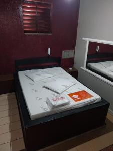 En eller flere senge i et værelse på Motel Sapucahy