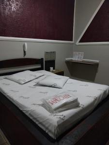 En eller flere senge i et værelse på Motel Sapucahy